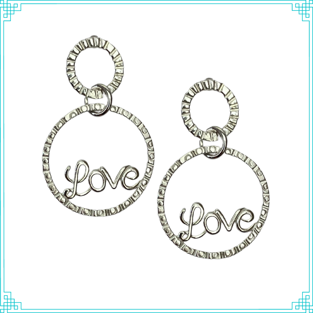 Sleeping Fox's handmade sterling silver post earrings feature line and circle textured ring with LOVE detail in the center, hanging from a smaller line textured circle.
