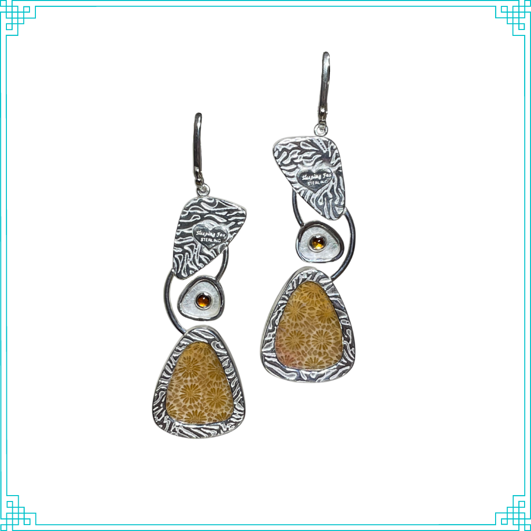 Sleeping Fox handmade silver jewelry presents these lever back earrings. With three sections, the back of the earrings display a coral texture on top, a citrine in the center, and a petrified coral window below.