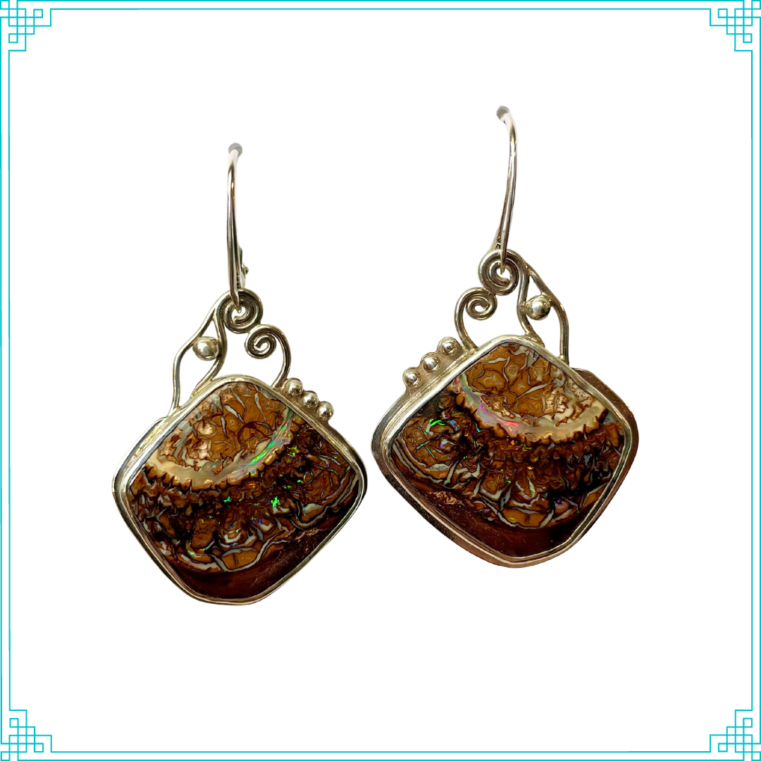 Sleeping Fox handmade silver jewelry earrings with Yowah Nut opals hanging from lever back ear wires.