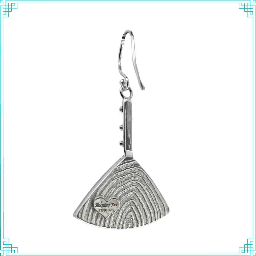 On the back of these Sleeping Fox silver earrings, the hallmark sits upon distinctive curved lines resembling tree rings. We hand make the sterling ear wires.