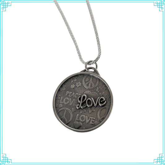 Sleeping Fox silver jewelry pendant with Peace and Love background and raised Love script lettering, hanging from 18' wheat chain.