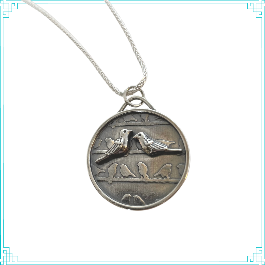 Sleeping Fox handmade silver jewelry pendant with two raised sterling silver birds on a background of birds on wires with an 18' wheat chain.