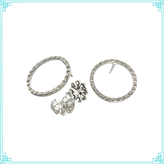 Sleeping Fox handmade sterling silver 16 gauge loop post earrings with lined texture.
