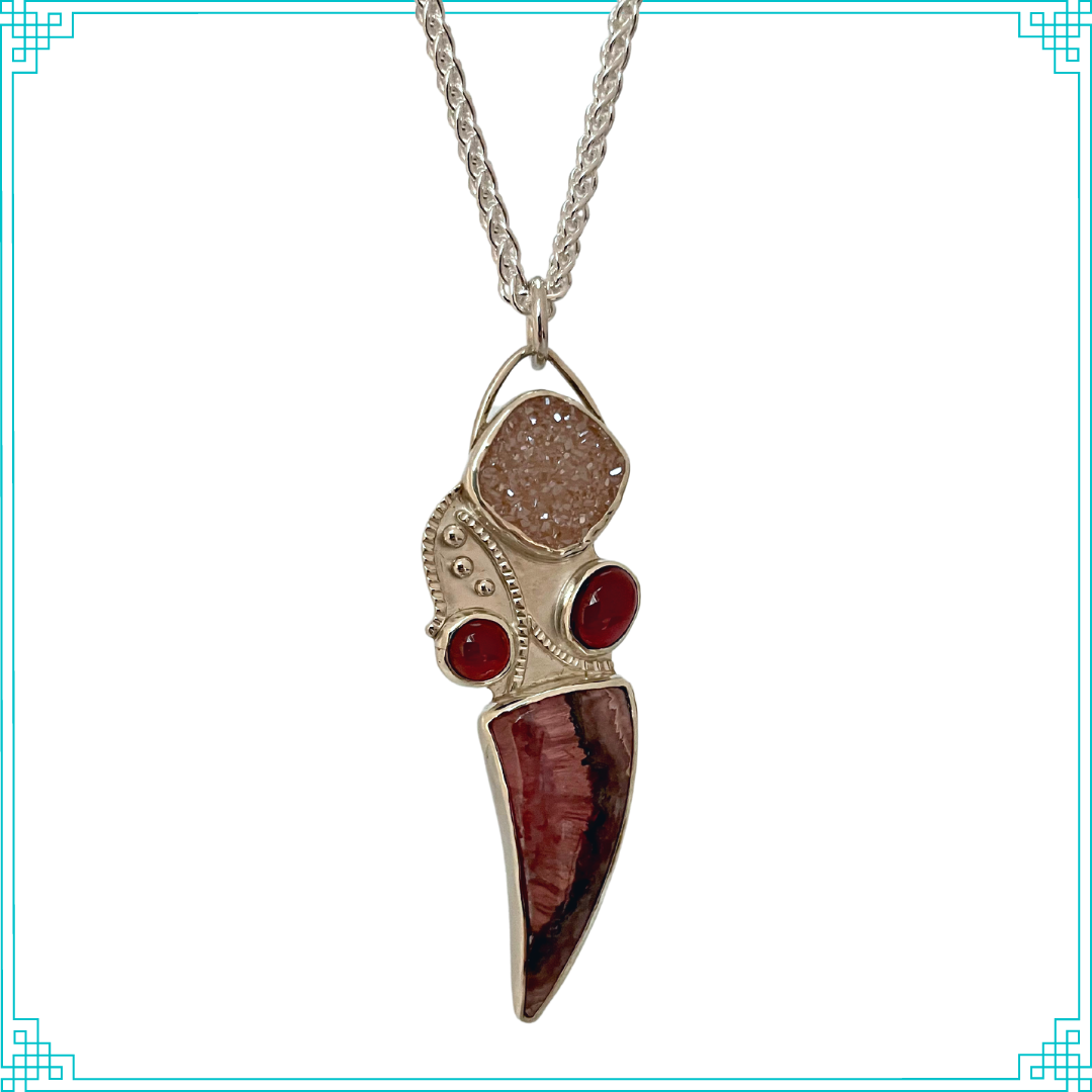 Sleeping Fox quality handmade sterling silver jewelry presents Ms Mermaid Pendant flowing with the current. The top stone is Brazilian Agate drusy, bottom stone is Rhodochrosite and the two red stones are semi-precious rubellite. 